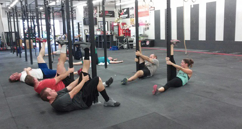 Athletes stretching at an Iron Athlete Mobility Clinic